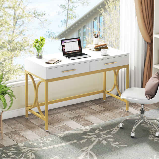 White and gold desk drawer open with gold handle