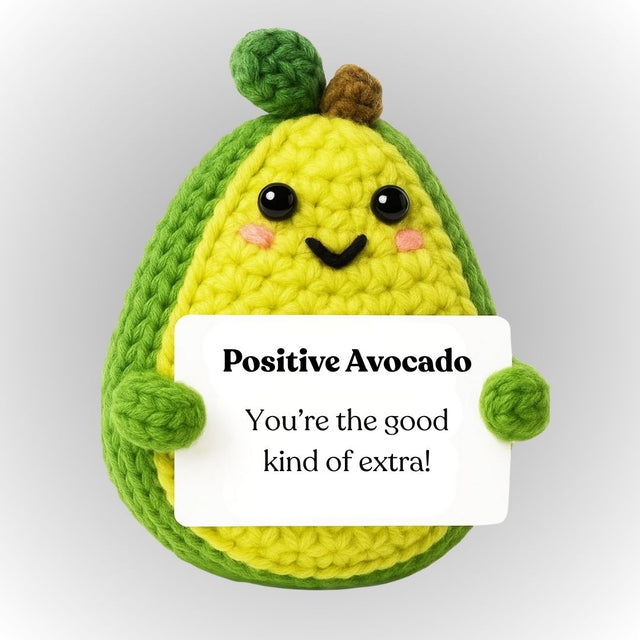 Crocheted avocado plushie holding a sign with text on a light gray background. Positive avocado emotional support plush cute gift for boyfriend girlfriend