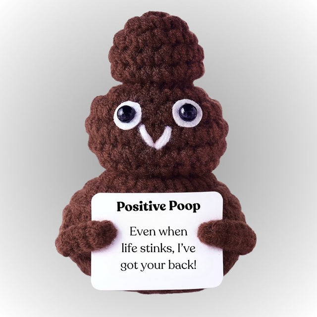 Plush toy resembling a brown poop emoji holding a sign with a message. Positive poop emotional support plush cute small brown crochet shit holding affirmative message gift for friends colleagues